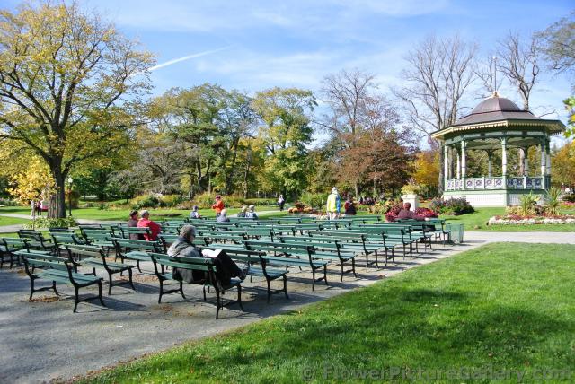 People relax on benches in front of Halifax Public Gardens Gazebo.jpg
