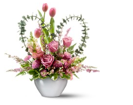 Picture of valentine flowers in pink with heart shape greens.PNG
