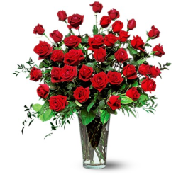 Big valentines day arrangement with red roses in glass vase.PNG