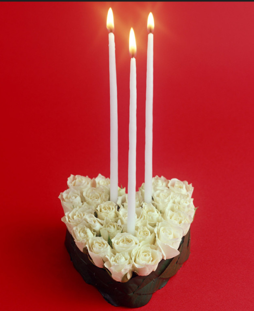 Modern valentines day with white fresh rose and white long candles.PNG