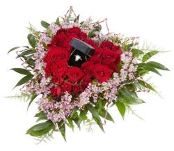 Valentines Day special bouquet with red roses and small purple flowers all shaped in heart and with diamond ring.JPG