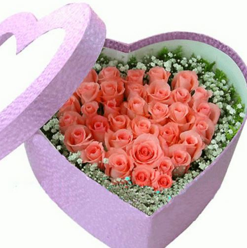 Peach roses in heart shape in purple heart shaped box.JPG