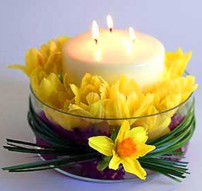 Easter candel centerpiece with Easter flowers.JPG