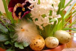 Easter center piece with Easter flowers and eggs.JPG