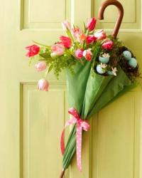 Unique Easter flowers decor with Easter flowers and Easter eggs on a green unbrella.JPG