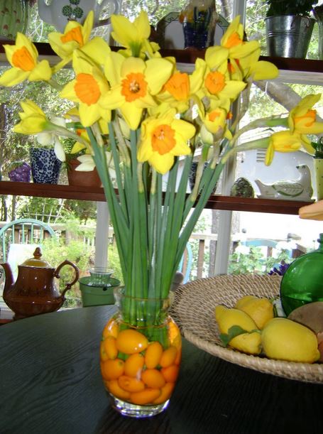 Yellow and orange easter flowers with fruits in vase.JPG