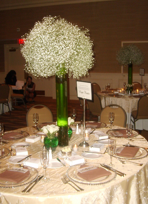 Elegant wedding settings picture with small white flowers.PNG