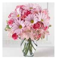 Light and dark pink mother's day flowers in glass vase.PNG