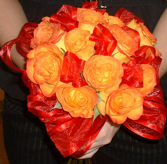 Image of Sunset bridal bouquet with red and orange flowers.PNG