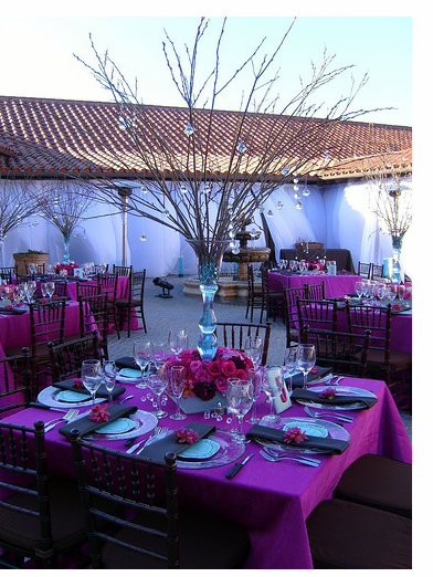 Beautiful wedding centerpiece with branches and pink flowers.PNG