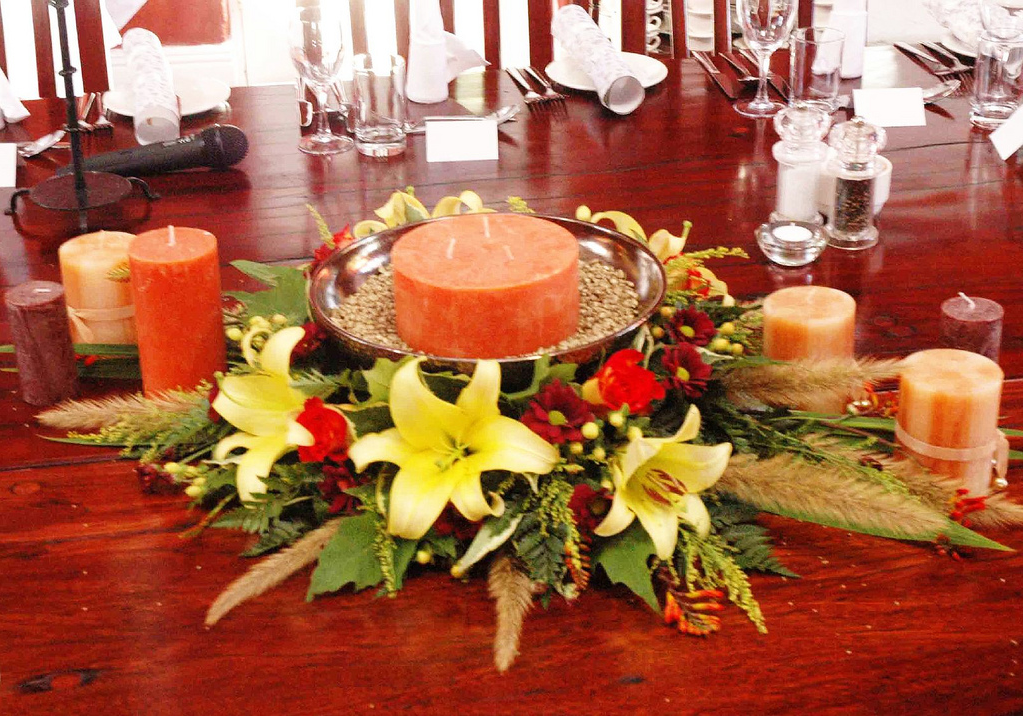 Orange candle centerpiece for wedding.PNG