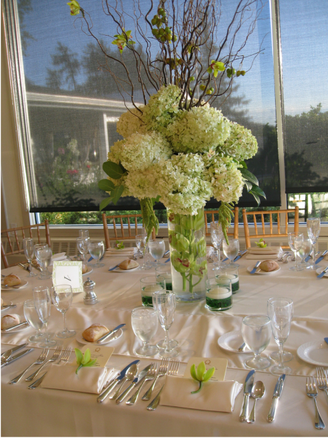 Picture of table flower arrangement with greenish white flowers.PNG