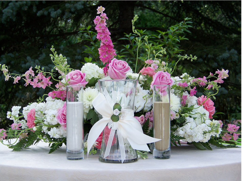 Reception table flower arrangement with white and pink flowers.PNG