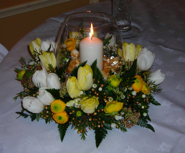 Table arrangement for wedding with yellow and white flowers.PNG
