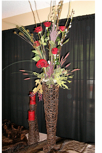 Very tall wedding centerpieces with red roses.PNG