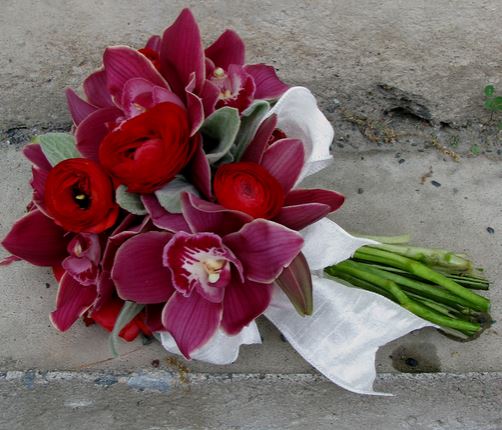 Unique flowers wedding bouquet with red flowers and magenta flowers.JPG
