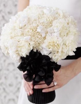 The Chanel Wedding bouquet pictures with beautiful white flowers with black.JPG
