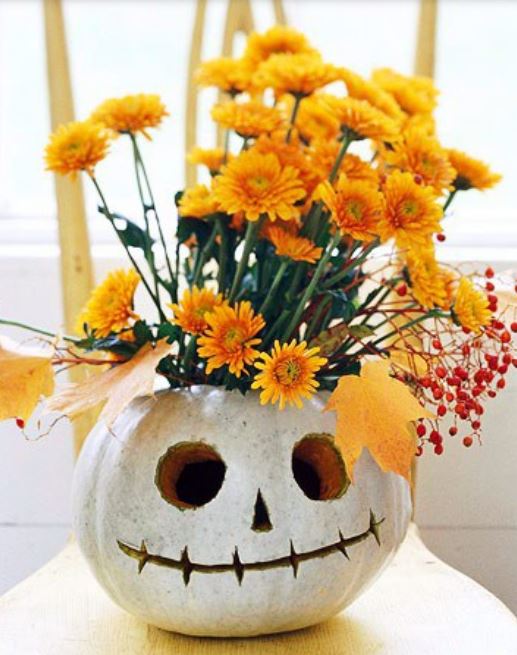 Pumpkin centerpiece with painted pumpkin with orange flowers.JPG