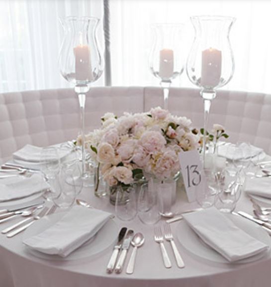Beautiful light colored flowers with candles.JPG