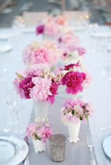 Beautiful summer wedding centerpieces with pink and hot pink flowers.JPG