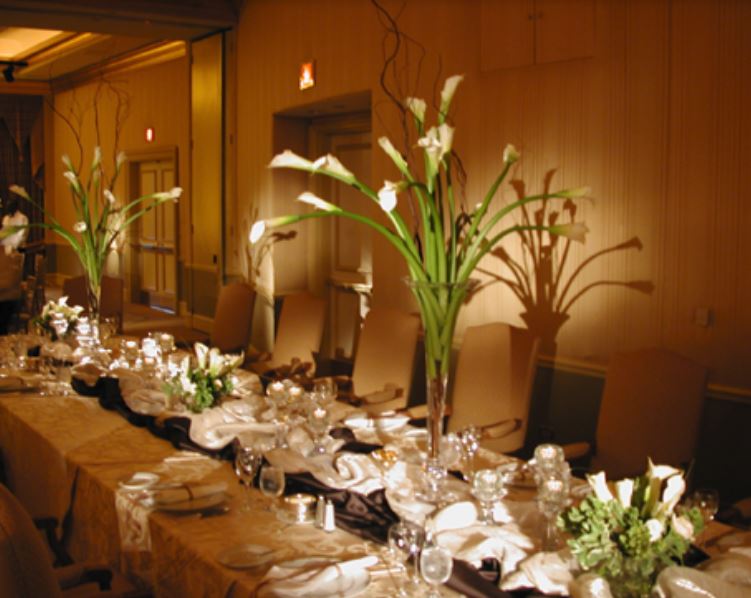 Long lilies wedding centerpieces with tall glass vases.JPG
