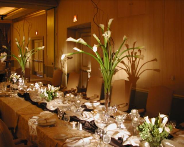 Long lilies wedding centerpieces with tall glass vases.JPG
