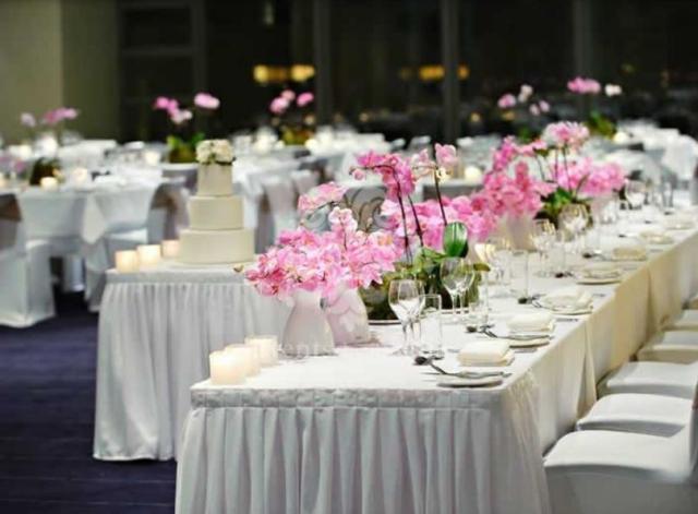 Wedding reception table cetnerpieces with pink flowers.JPG