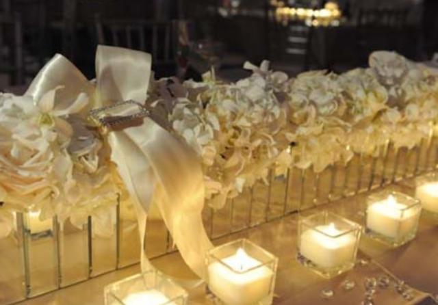 White flowers and white candles for wedding.JPG