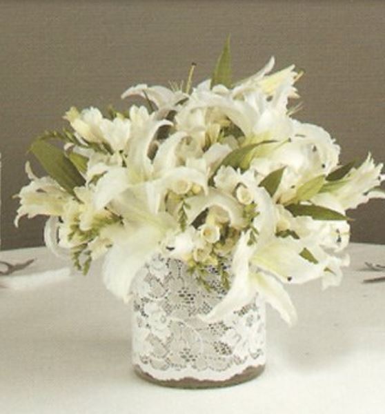 White wedding centerpiece with white large lilies.JPG