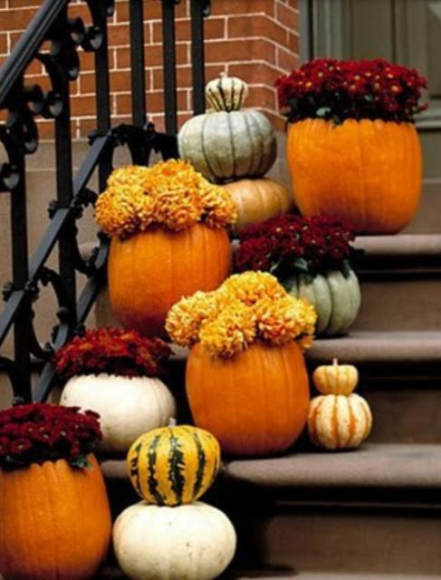 Front door halloween decoration with pumpkins.JPG