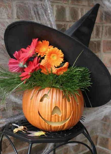 Halloween pumpkin decor with witch hat.JPG