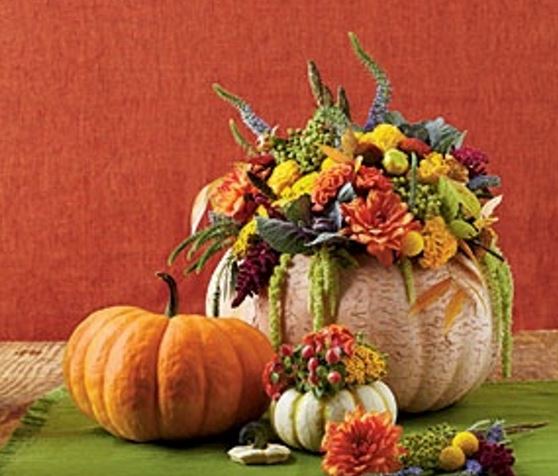 Fall centerpiece with Autumn flowers and pumpkin vases.JPG
