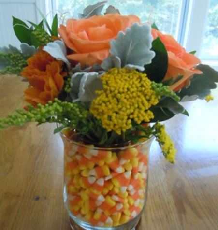 Chic Fall flower arrangement with candy corn.JPG