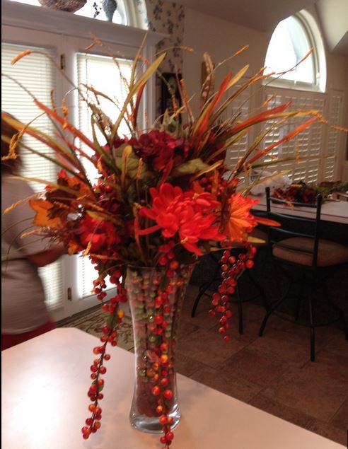 Fall arrangment with red flowers and berries.JPG