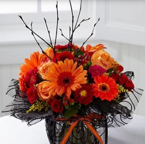 Fresh flowers centerpiece perfect for Hallowe.JPG
