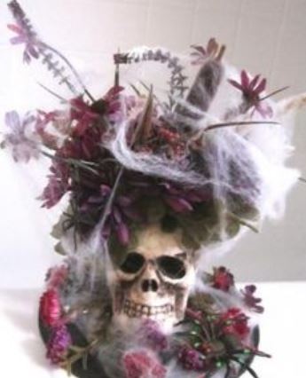 Skull centerpiece with fresh flowers and spider web perfect for halloween.JPG
