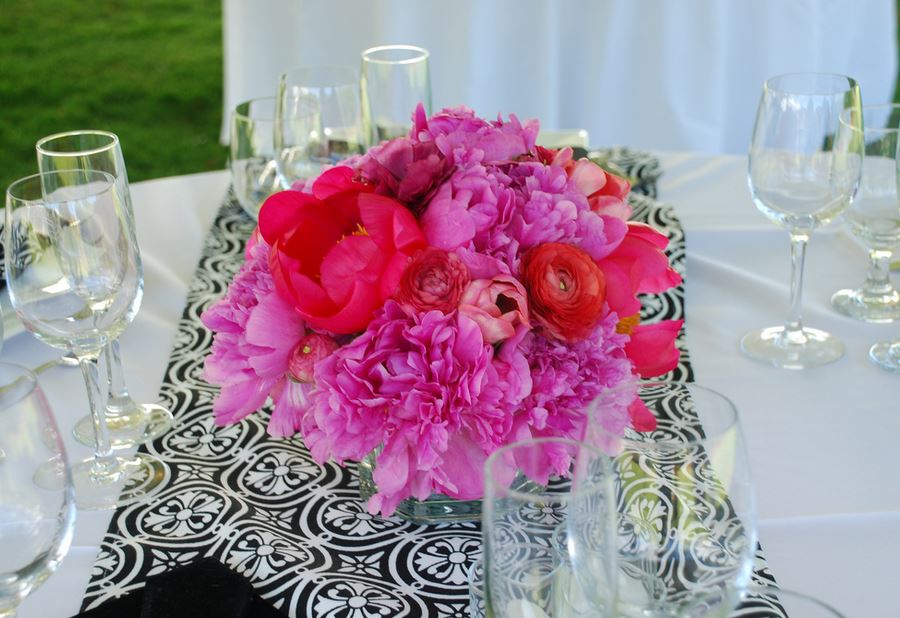 Summer wedding arrangment with hot pink flowers