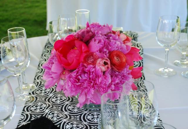 Summer wedding arrangment with hot pink flowers