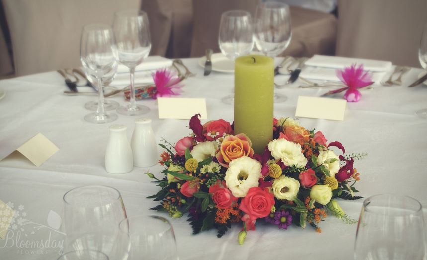 wedding flowers and candle arangement