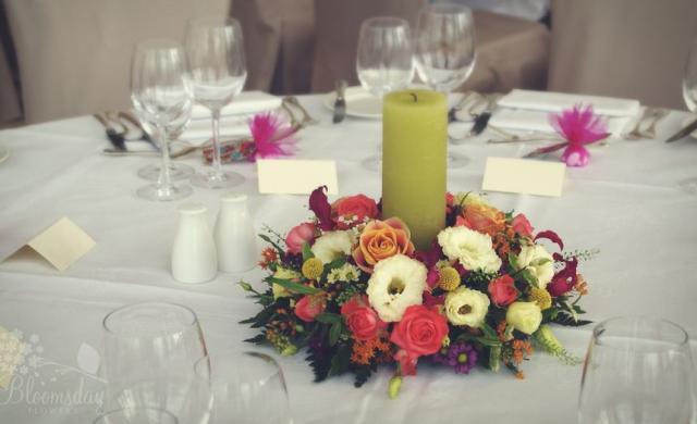 wedding flowers and candle arangement