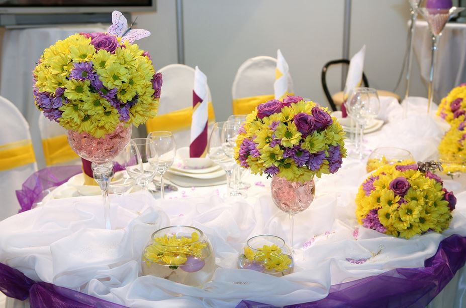 Pretty wedding table setting with bright flowers