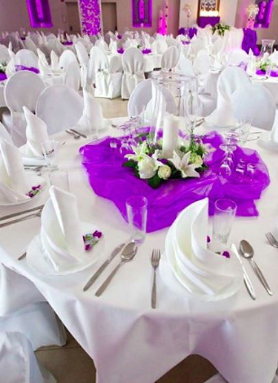 Purple and white wedding table decor with white flowers