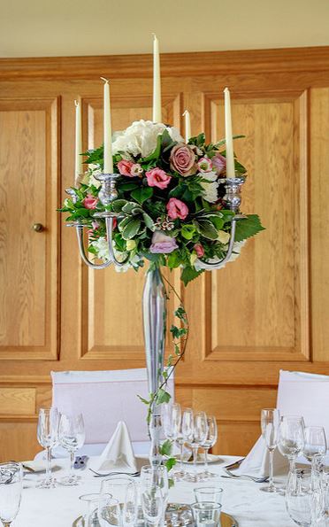 Tall wedding centerpiece with candles