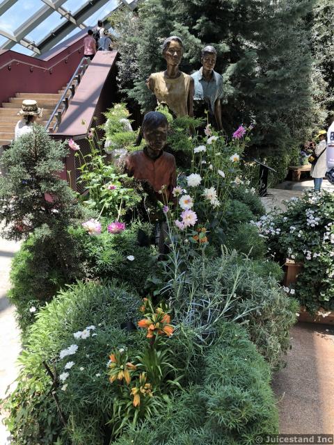 Tourist Statues inside Flower Dome