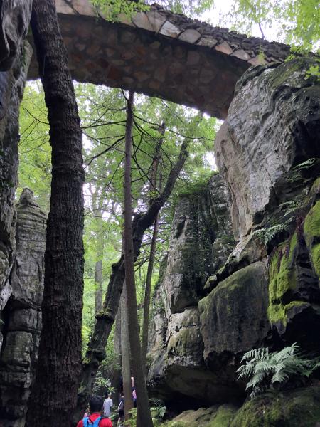 Walking Under Bridge at Rock City Gardens trail