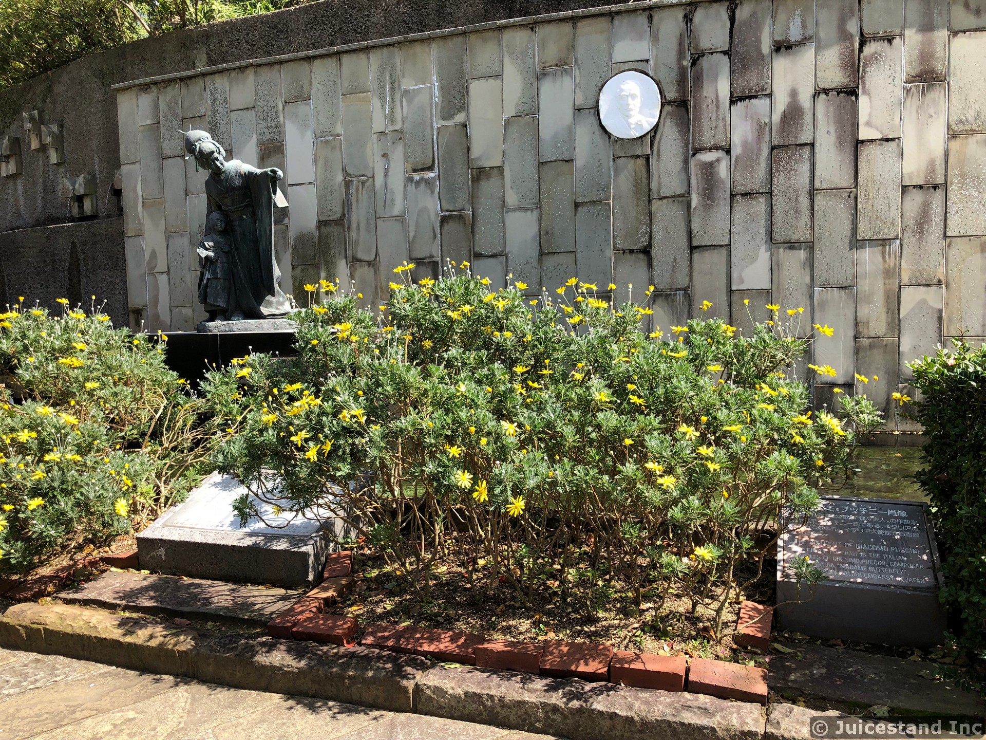 Mother and Son Statue and Daisy Garden