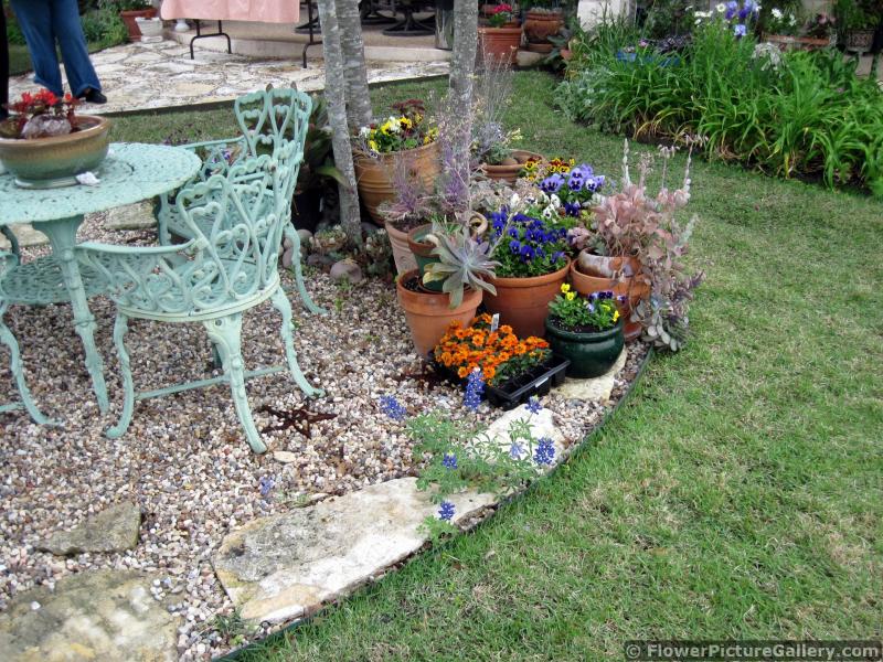 Container Flower Garden next to Patio Table and Chairs