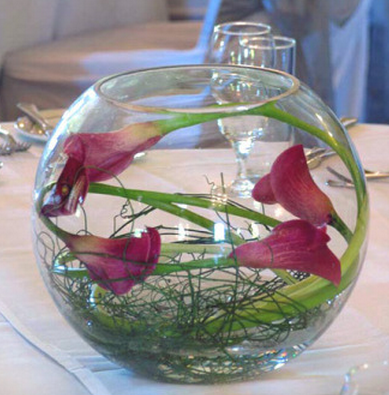 Unique centerpiece with purple lilies in a fish ball.PNG