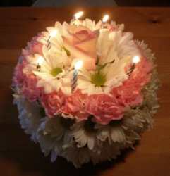 Fresh birthday cake in pink with candels.PNG