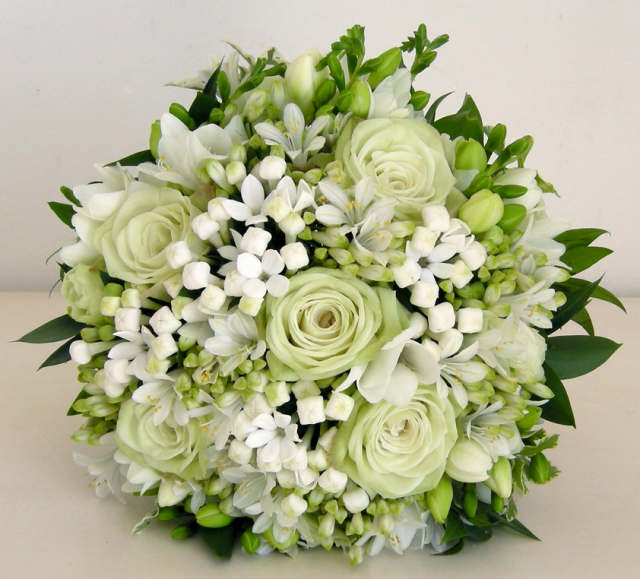 white greenish roses with small white flowers.PNG